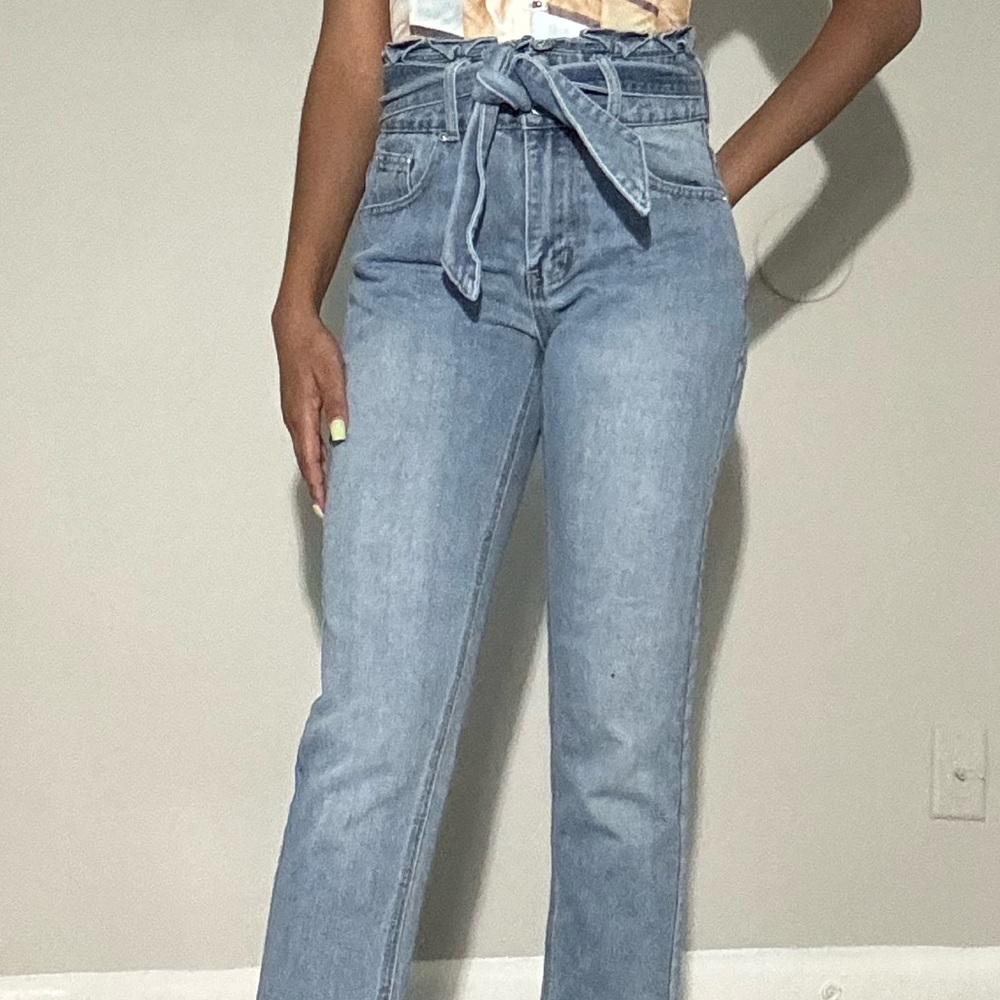 High-waisted, light wash, tie-waist jeans
